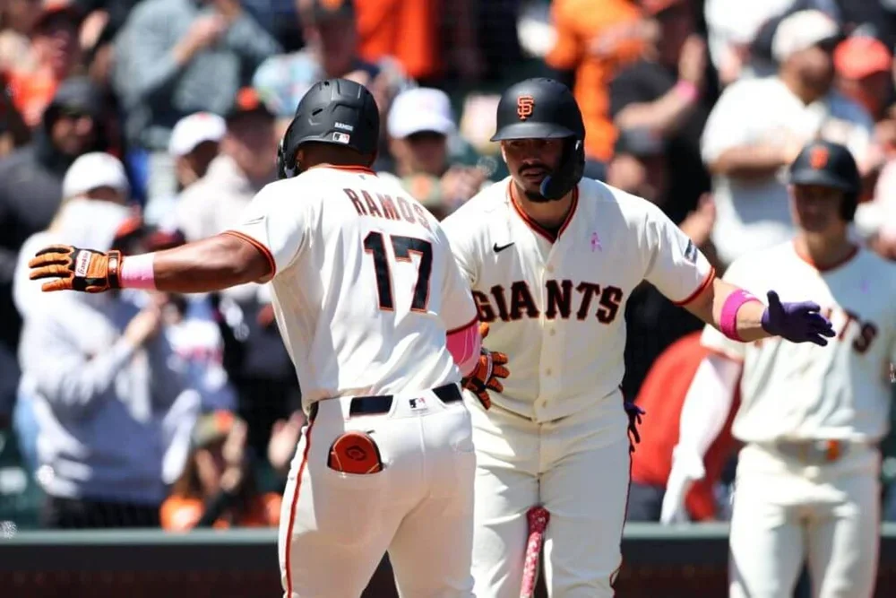 Heliot Ramos, No. 17, of the San Francisco Giants celebrates his solo home with Willy Adames, No. 2, during the fourth inning against the Pittsburgh Pirates.